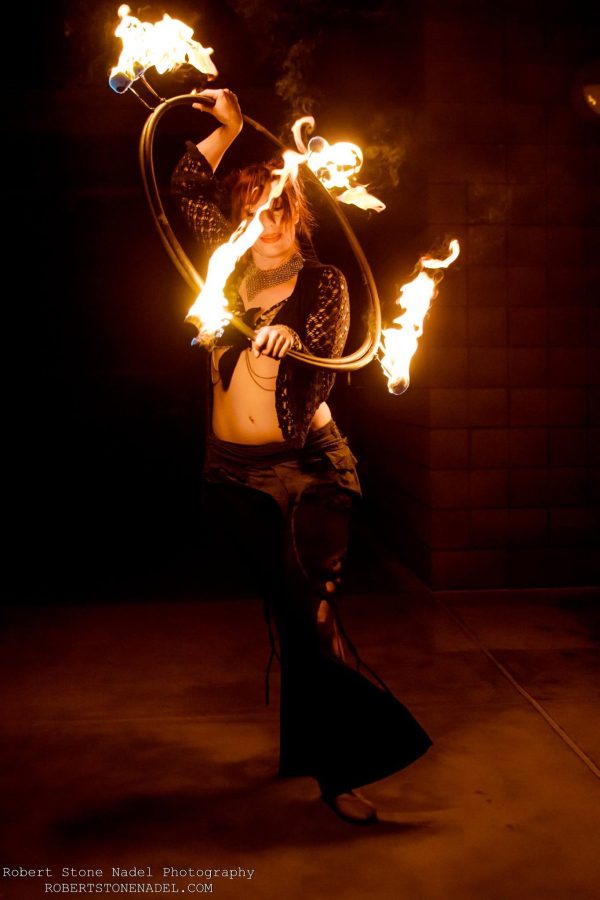 Fiora Firefly dances with hula hoops in one of her San Diego fire shows